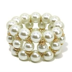 Joan Boyce simulated white pearl with gold and crystals 3 row stretch bracelet.